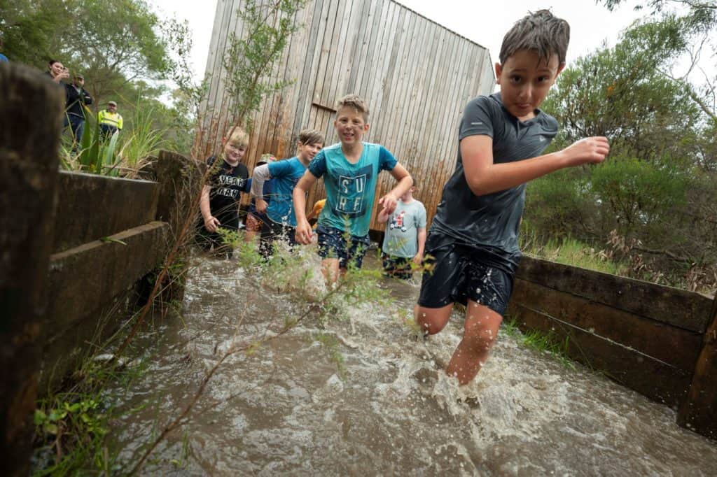 Kids running through water