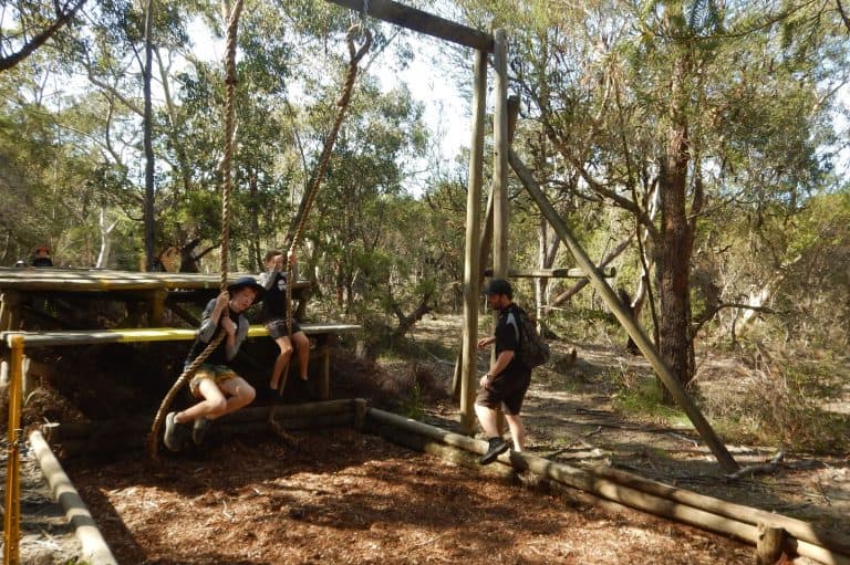 low ropes Scouts swinging on ropes